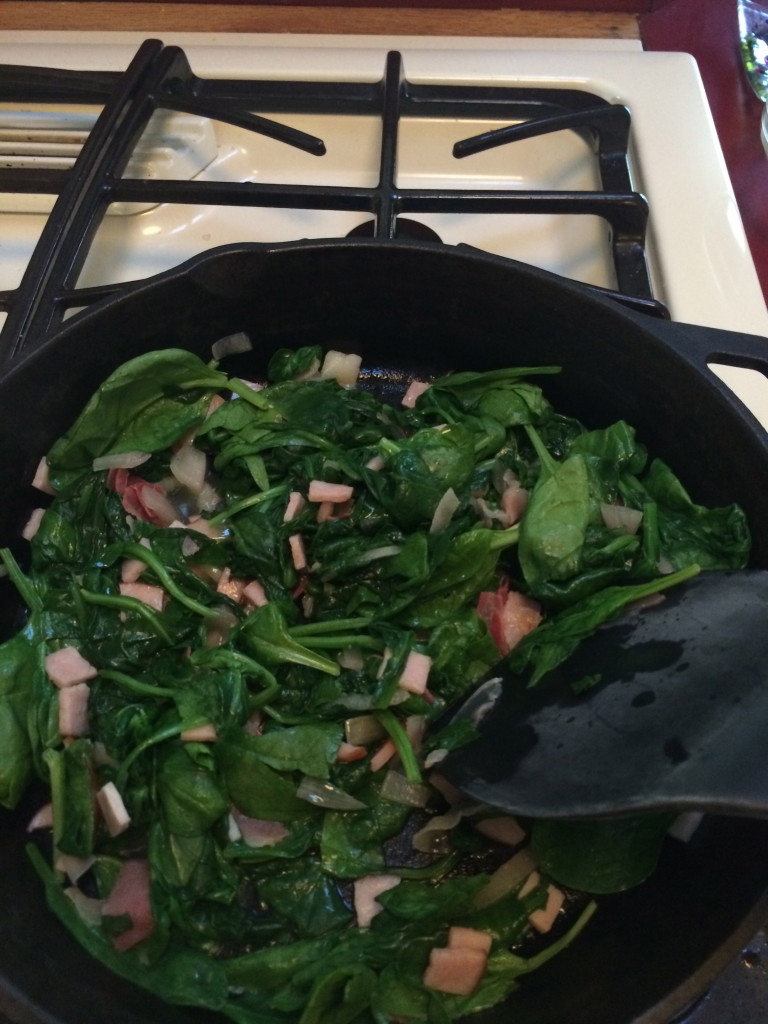 After just a few minutes of stirring your spinach will cook down, seen here.